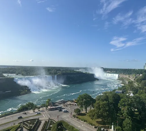 Panoramic view of both the American and Horseshoe Falls, showcasing the unique perspectives from both sides of the border