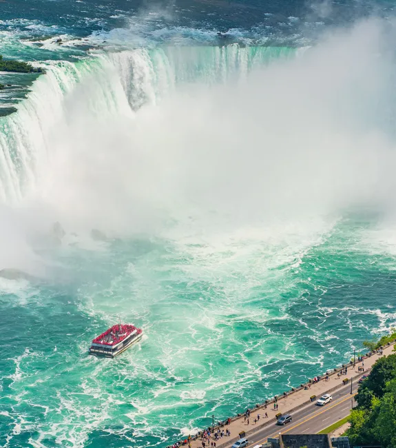 Stunning aerial view of Niagara Falls showcasing the majestic Horseshoe Falls with mist rising from the cascading waters