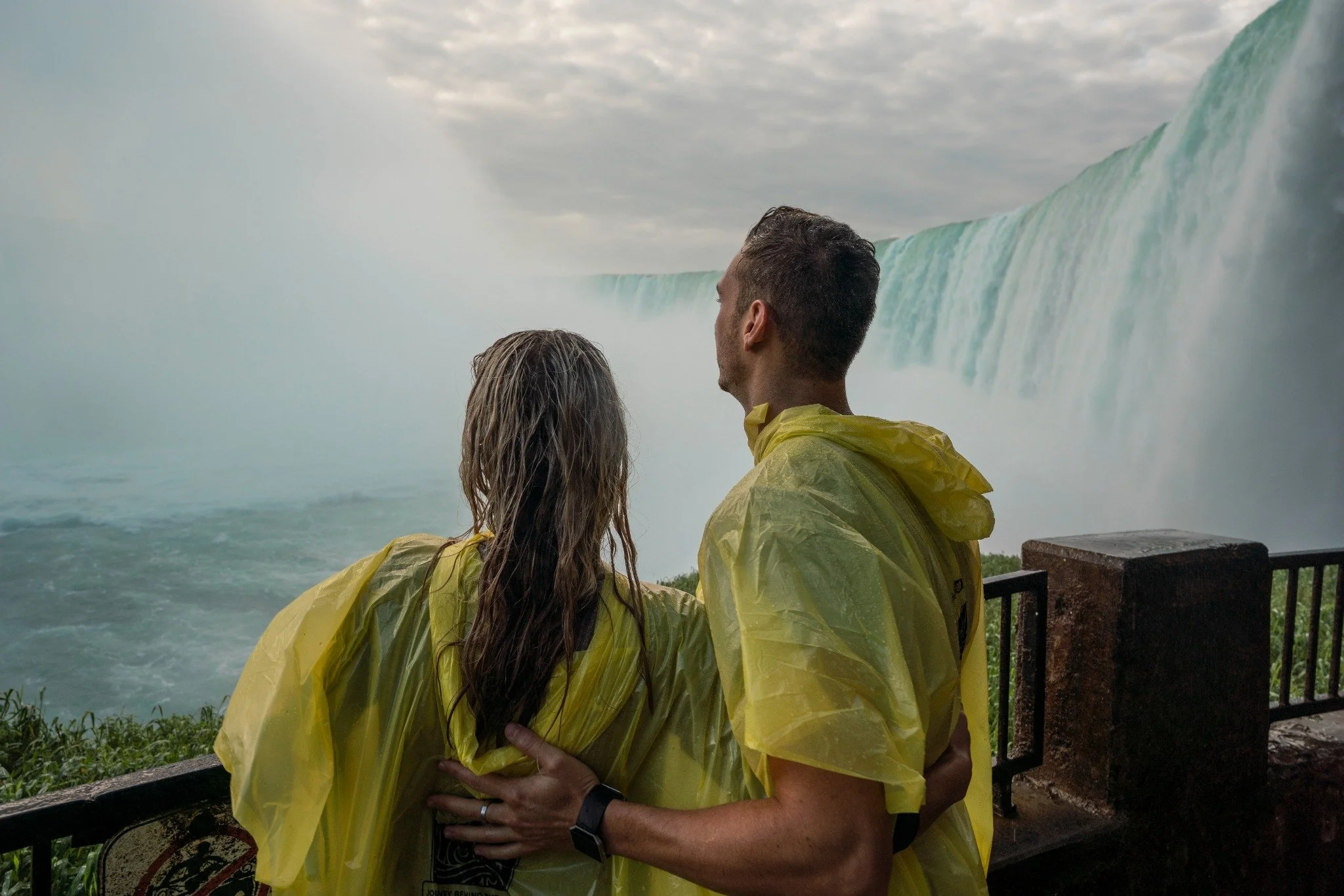 Couple enjoying Journey Behind the Falls winter experience