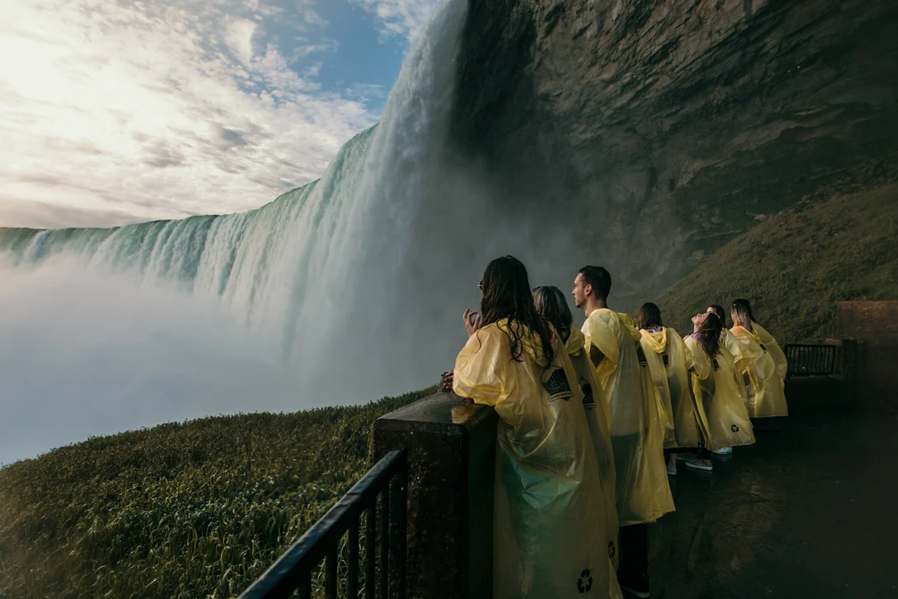 Tour group soaking in spectacular views of Horseshoe Falls from the lower observation deck